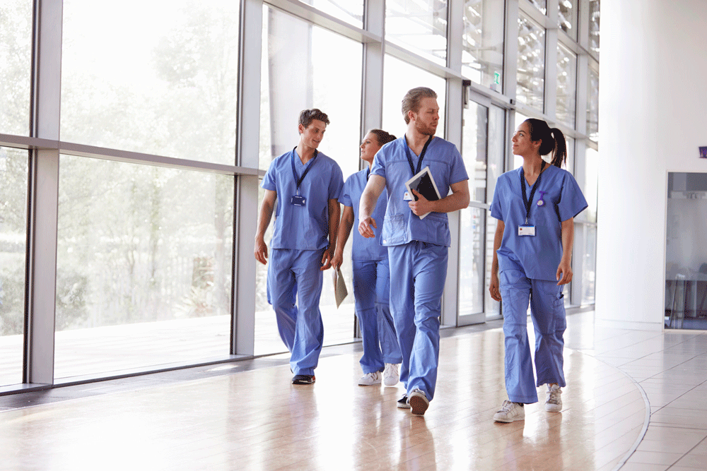 Young doctors walking down a hallway.