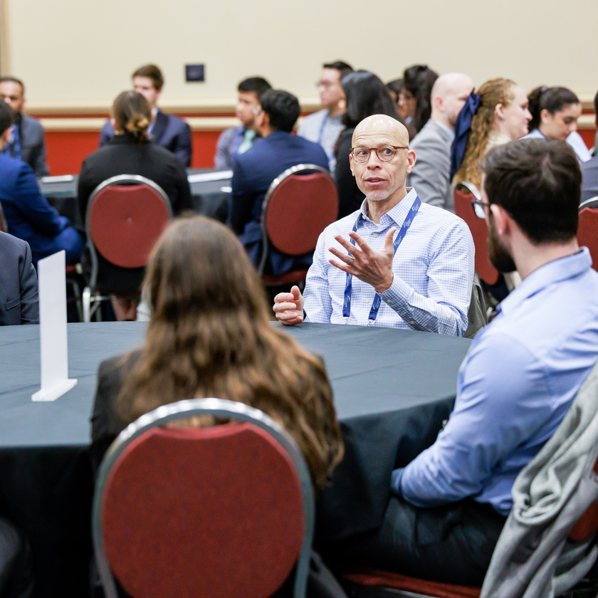 Group of SIR volunteers talking at Annual Scientific Meeting