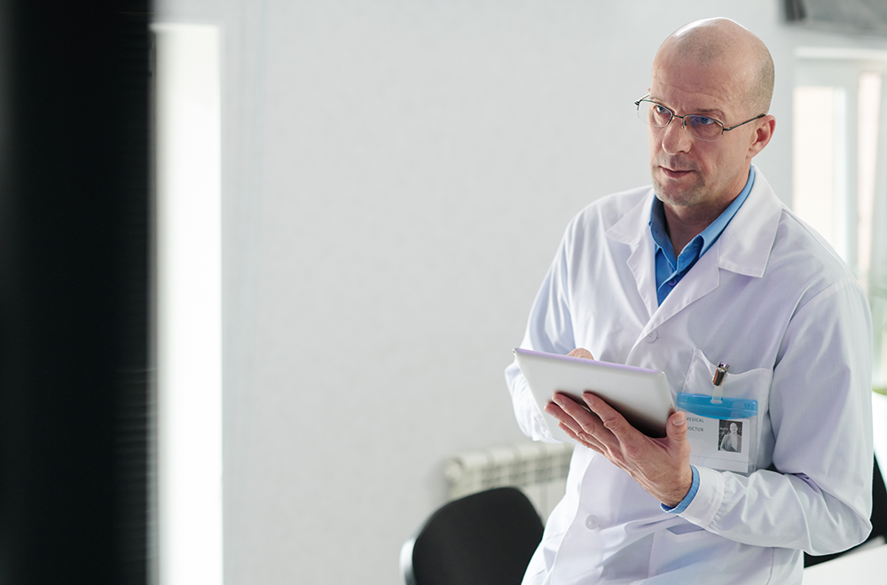 Man working on tablet looking at screen